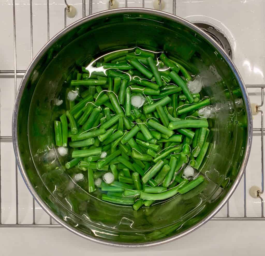 Green beans in a cold water bath