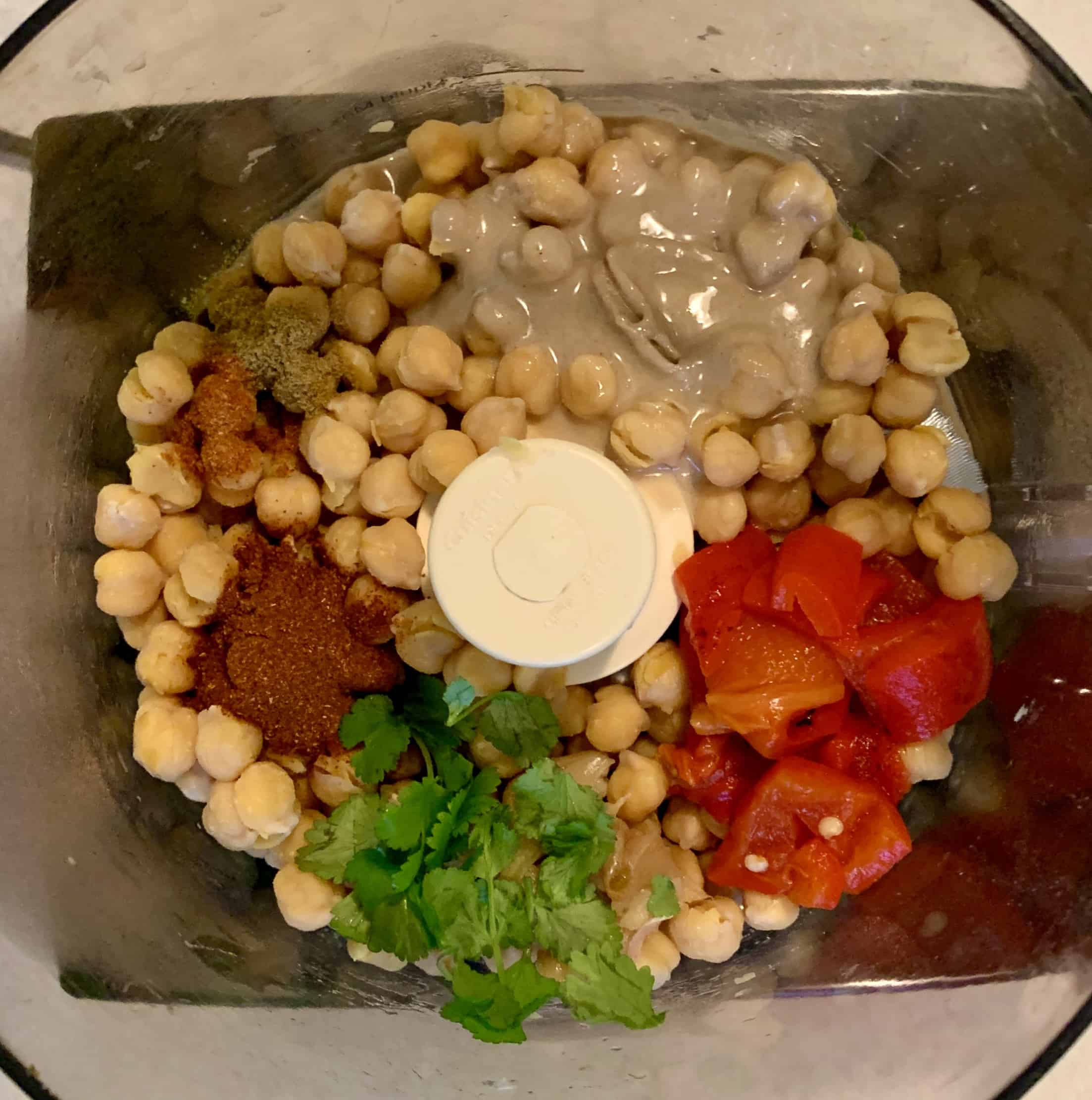 Hummus ingredients including chickpeas in a food processor