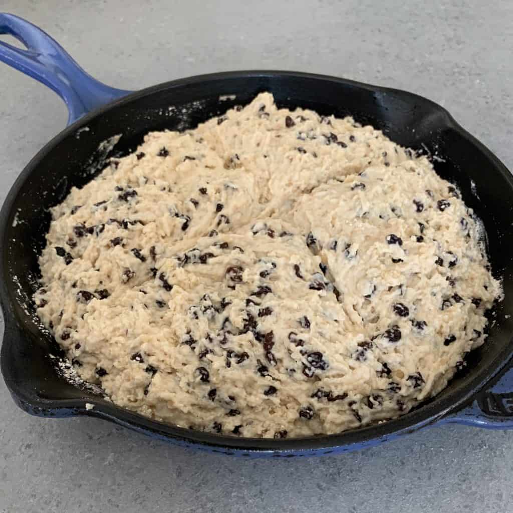 A close up of Irish soda bread in a pan before being baked 