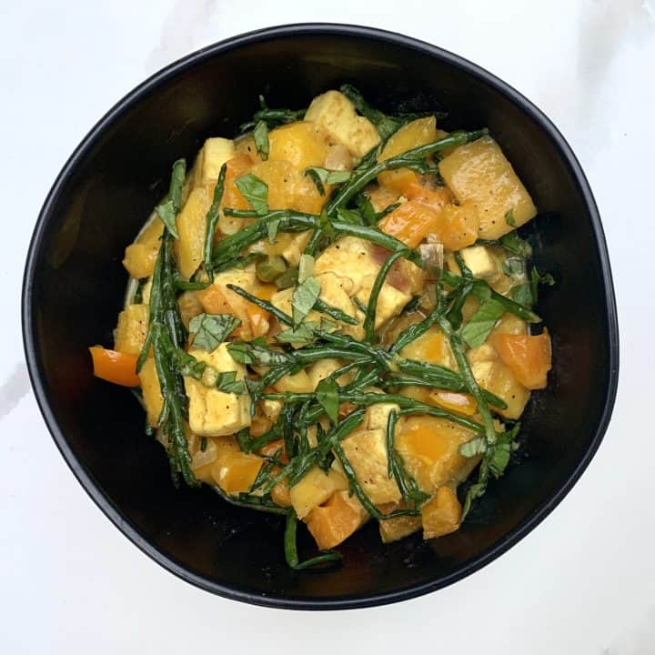 Mango Thai Tofu plated in a black bowl