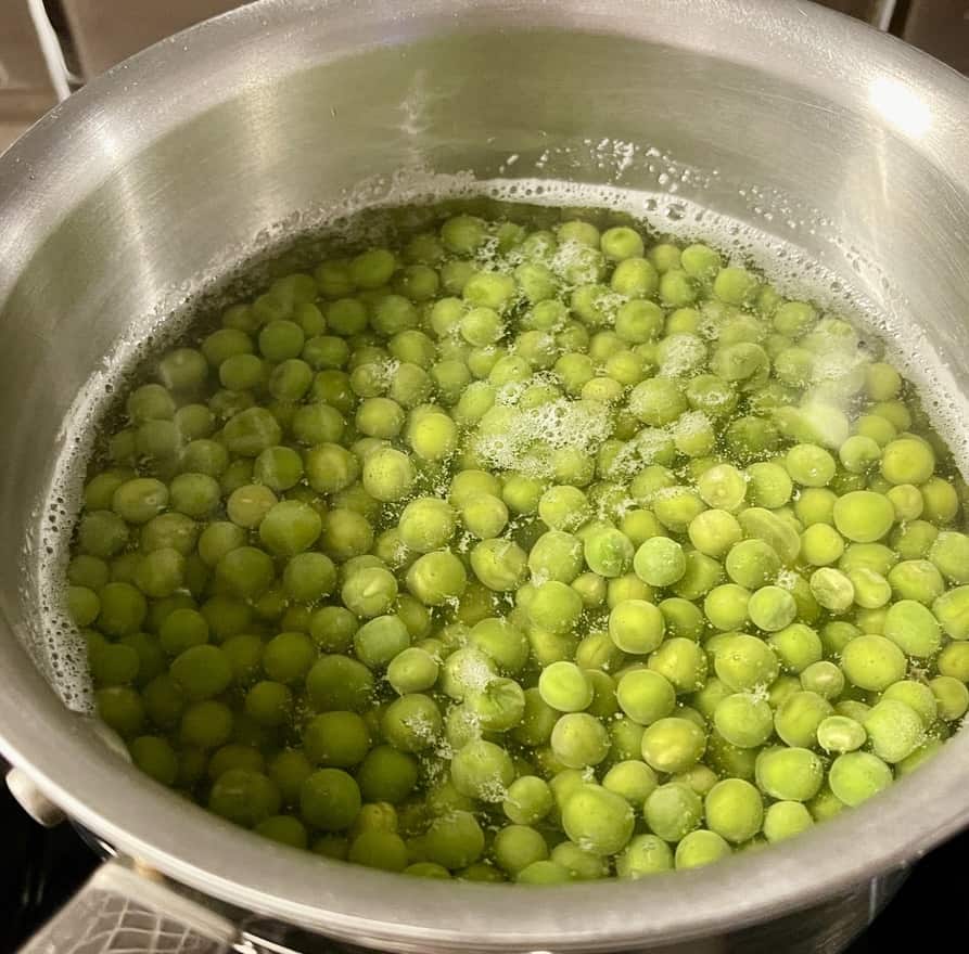 Peas being cooked in a Pot of water