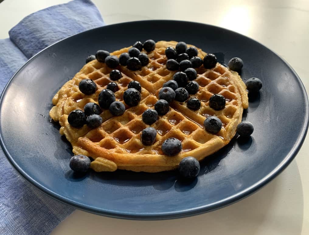 Sweet Potato Waffles with Berries on a blue plate