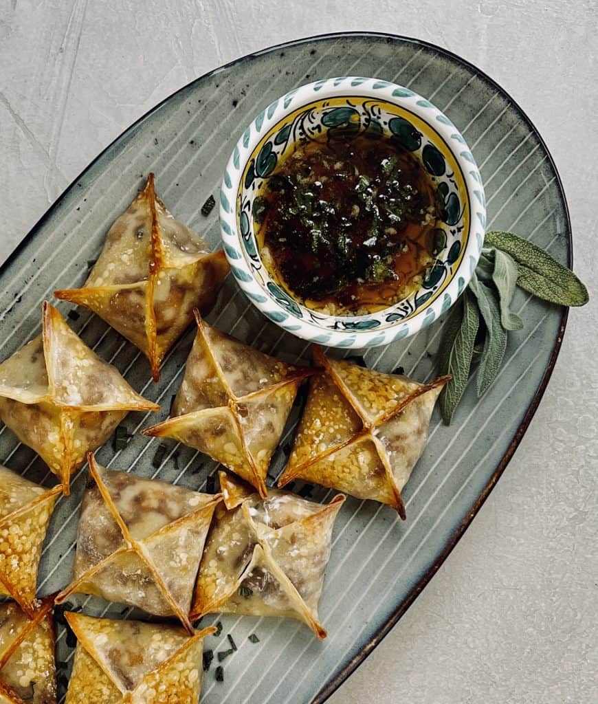 Roasted Butternut Wontons on serving platter with dip
