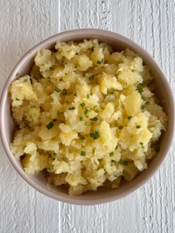 Easy Mashed Rutabaga in a bowl topped with chives